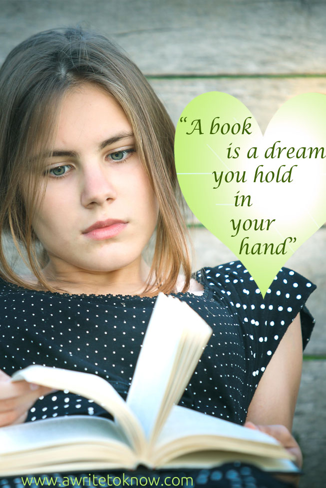 A girl reflects as she holds a book, with text that says “A Book is a Dream You Hold in Your Hand”